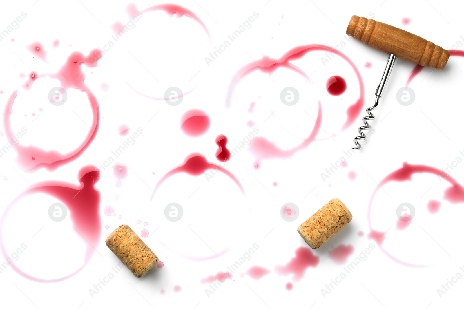 Photo of Red wine rings, drops, bungs and corkscrew on white background, top view