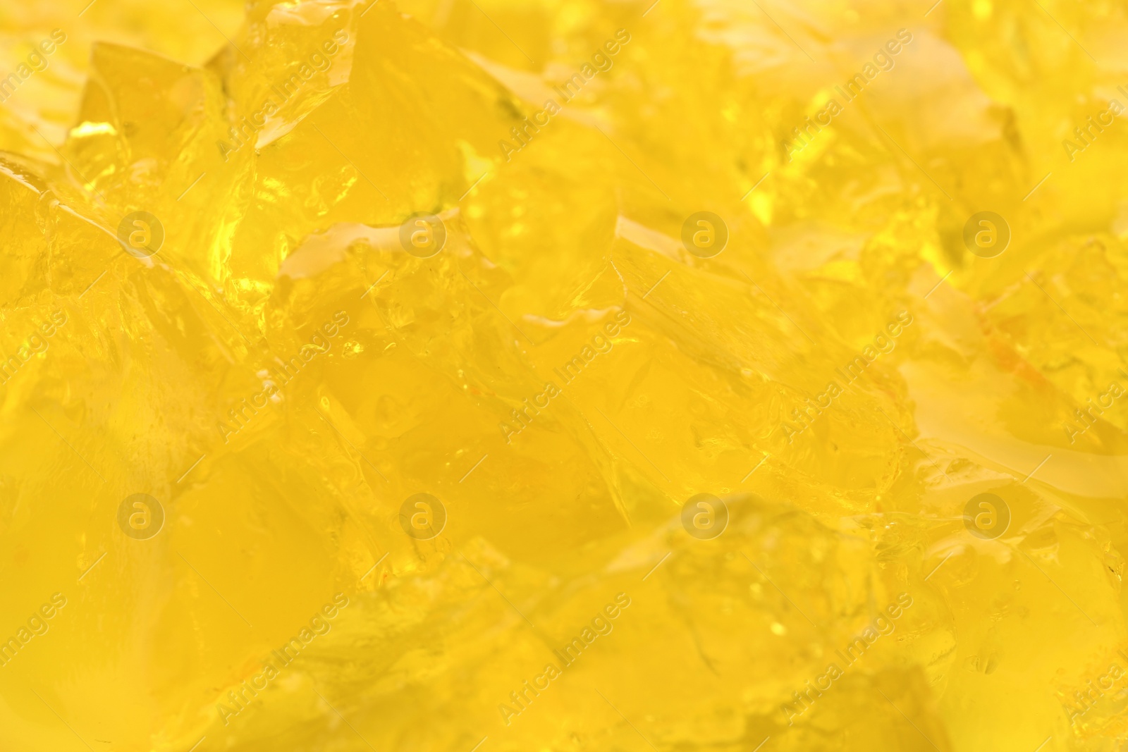 Photo of Yellow tasty fruit jelly as background, closeup