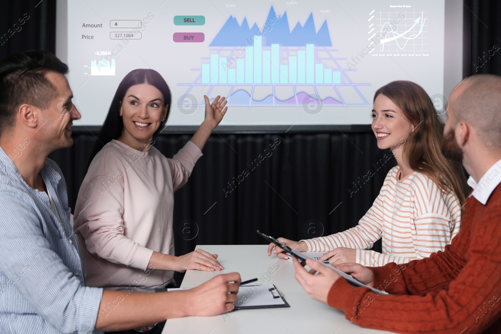 Image of Business people having meeting in office and financial charts on projection screen. Forex conference  