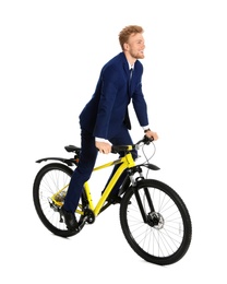 Young businessman riding bicycle on white background