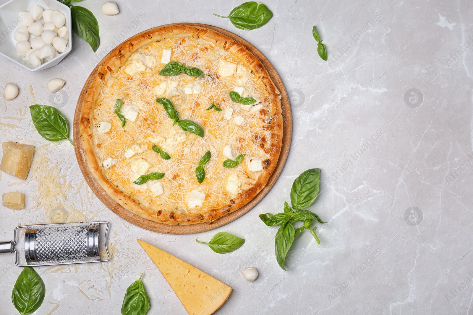 Photo of Flat lay composition with delicious pizza and ingredients on table