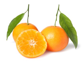 Photo of Fresh ripe juicy tangerines with green leaves isolated on white