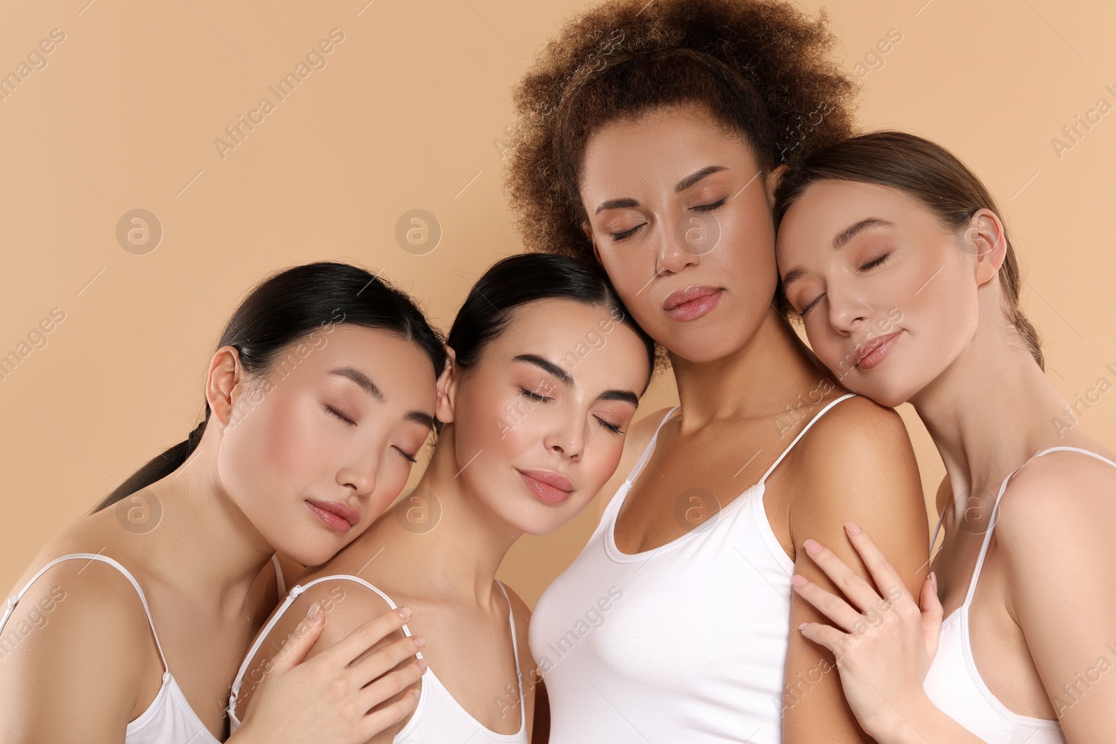 Photo of Beautiful young women with healthy skin on beige background