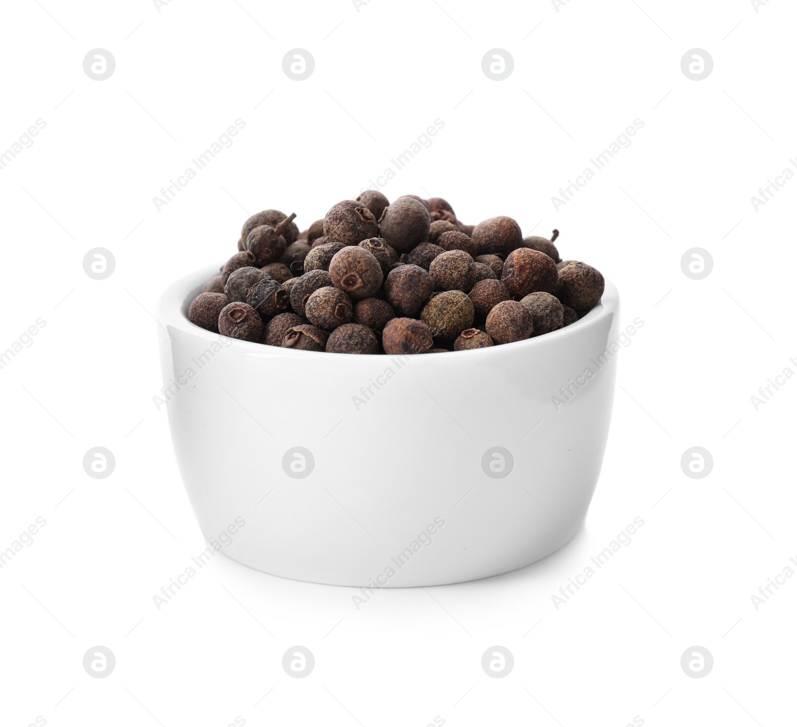 Photo of Black pepper in bowl isolated on white