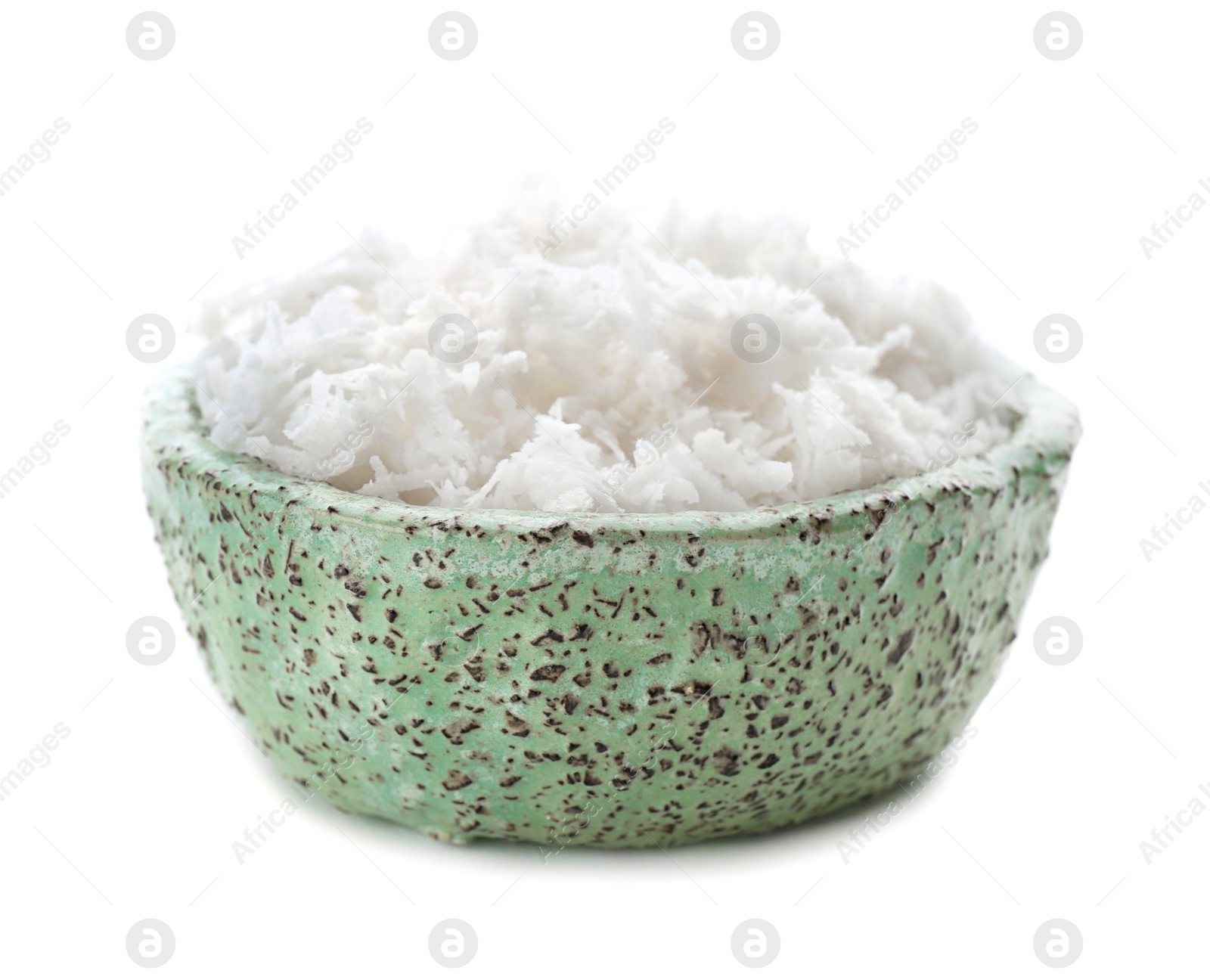 Photo of Fresh coconut flakes in bowl on white background