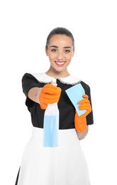 Photo of Young chambermaid with rag and detergent on white background