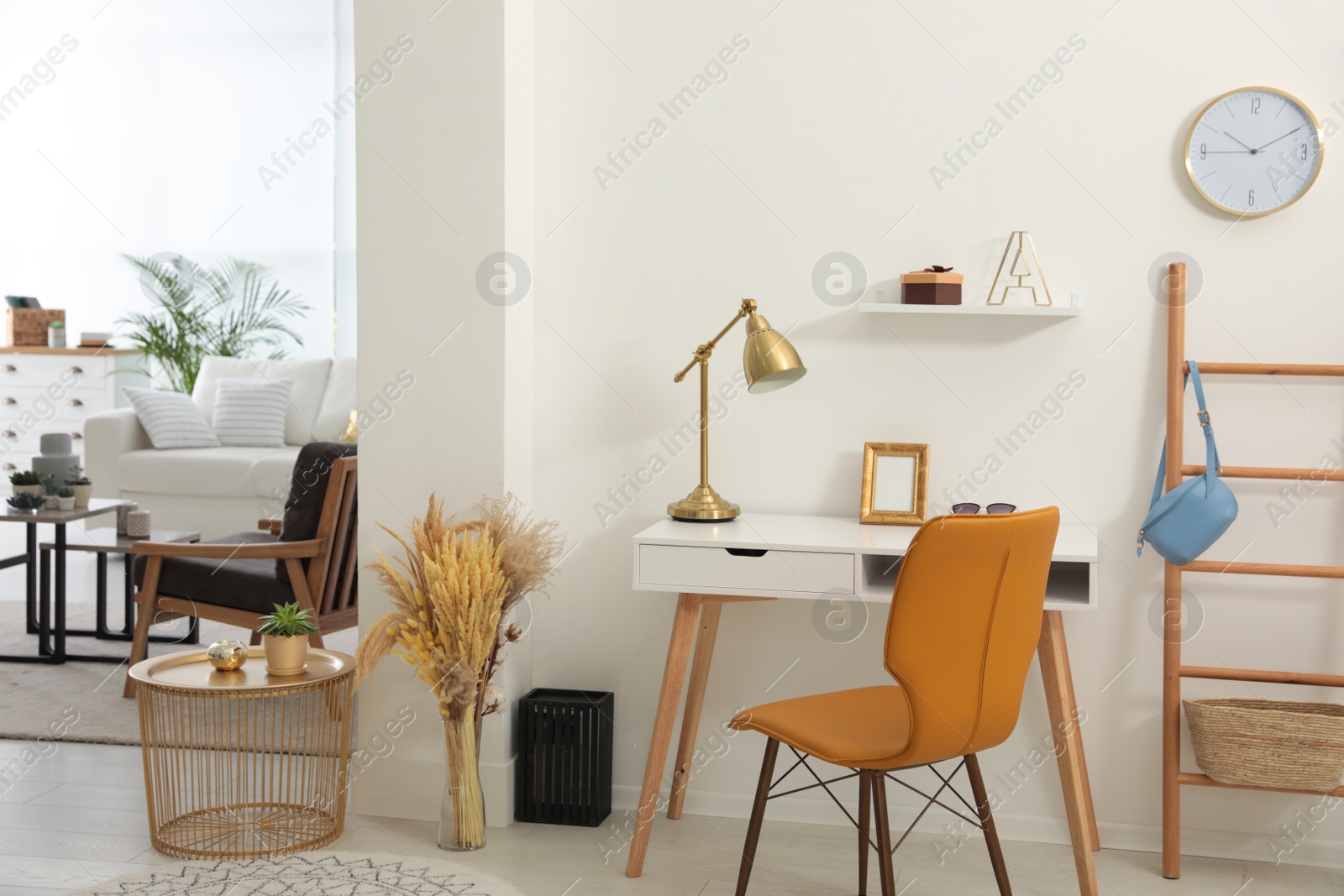 Photo of Living room and workplace in spacious apartment. Interior design