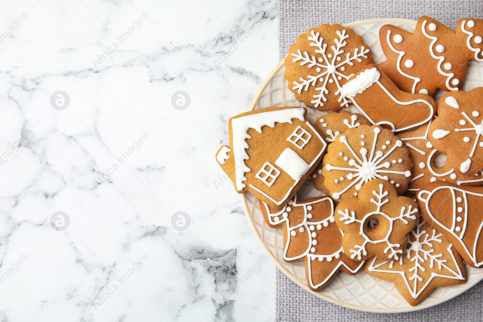 Photo of Plate with tasty homemade Christmas cookies on table, top view