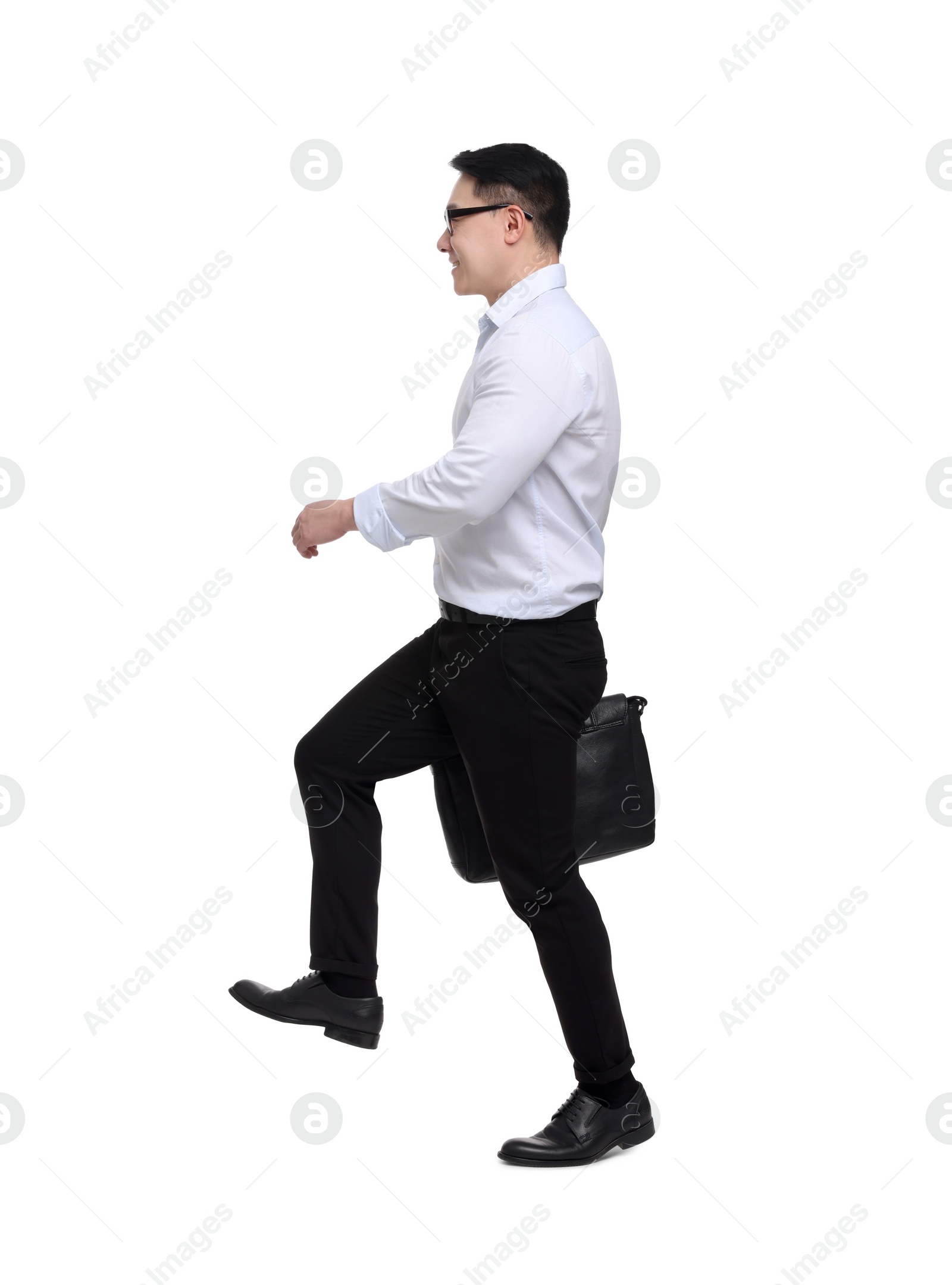 Photo of Businessman with briefcase walking on white background