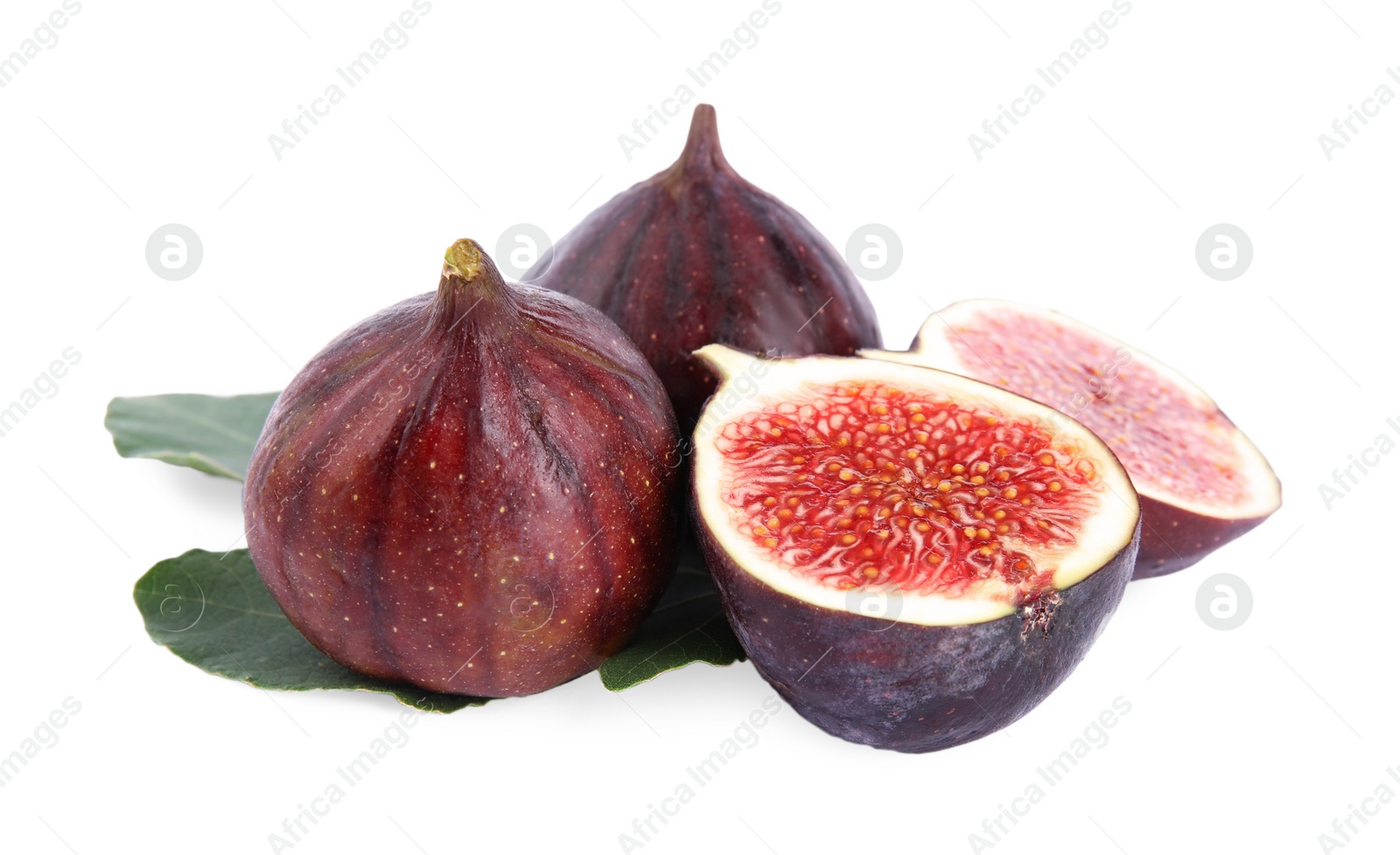 Photo of Fresh juicy purple figs and green leaves on white background