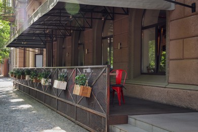 Photo of Beautiful view of modern cafe with outdoor terrace