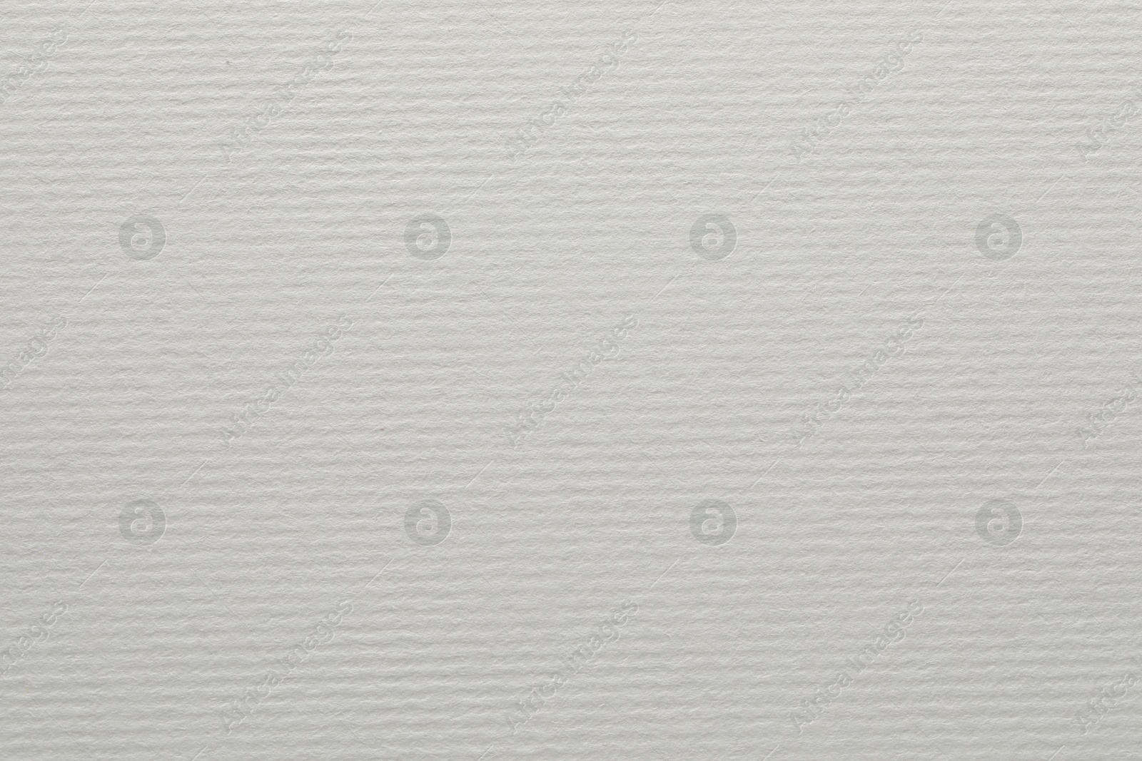 Photo of Texture of white paper sheet as background, closeup