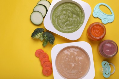 Photo of Flat lay composition with healthy baby food on yellow background. Space for text