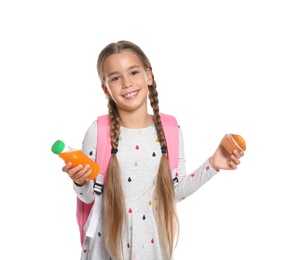 Schoolgirl with healthy food and backpack on white background