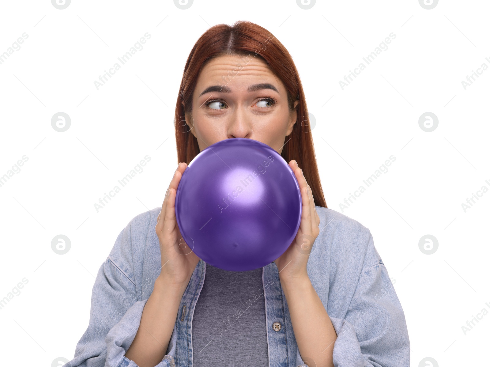 Photo of Woman inflating purple balloon on white background