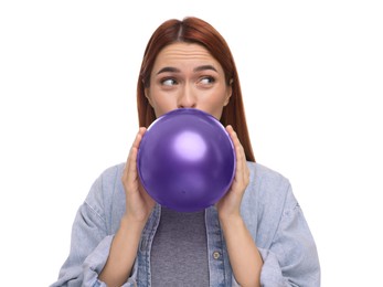 Photo of Woman inflating purple balloon on white background