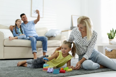 Happy family spending time together at home