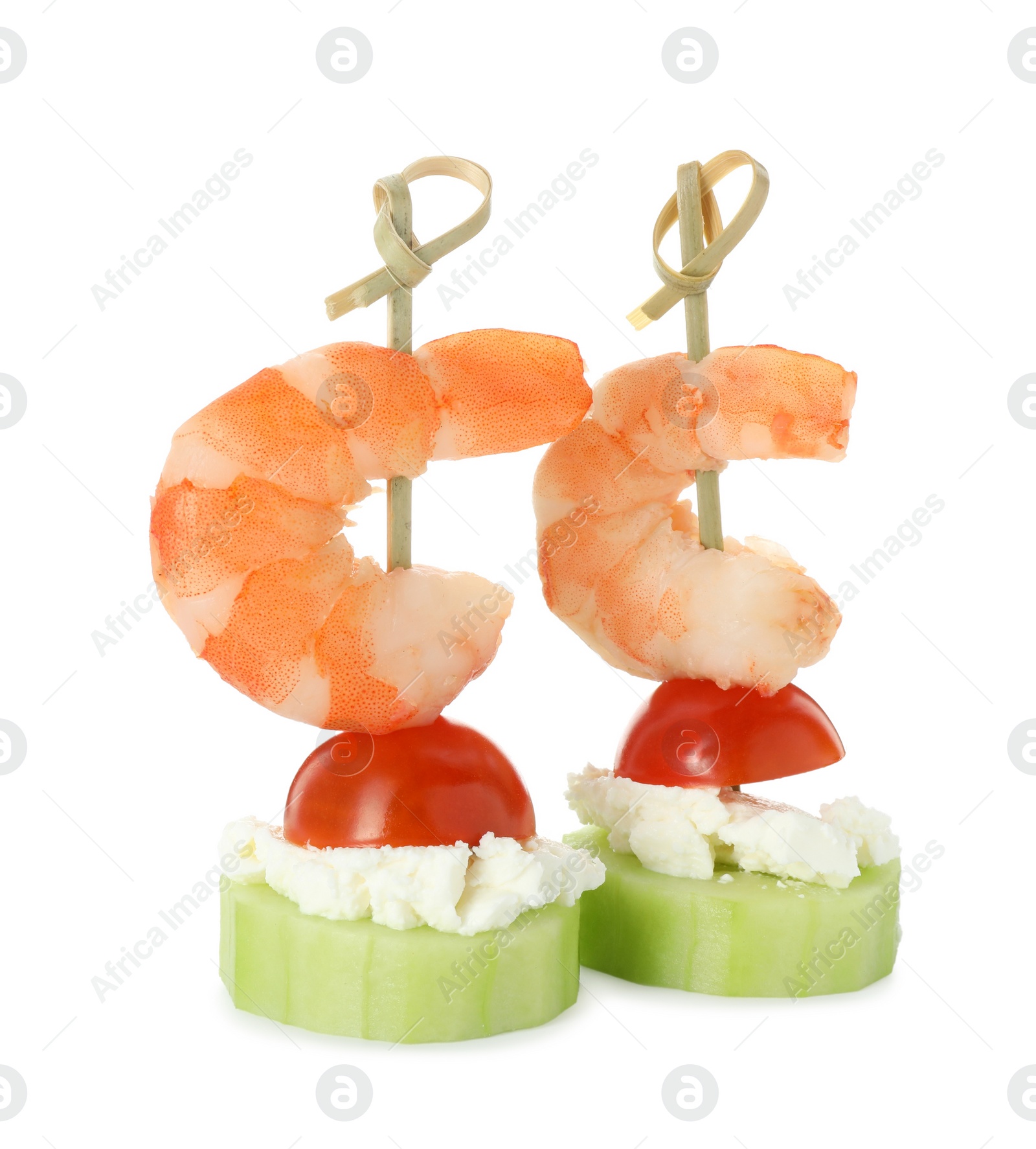 Photo of Tasty canapes with shrimps, vegetables and cream cheese isolated on white