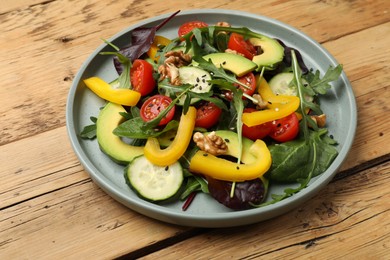 Balanced diet and vegetarian foods. Plate with different delicious products on wooden table