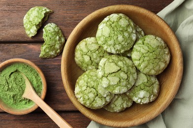 Bowl with tasty matcha cookies and powder on wooden table, flat lay