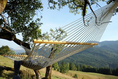 Photo of Comfortable net hammock in mountains on sunny day