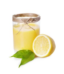 Delicious lemon curd in glass jar, fresh citrus fruit and green leaves isolated on white