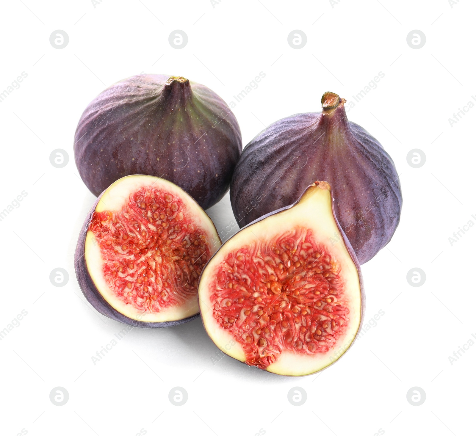 Photo of Whole and cut purple figs on white background