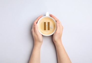 Coffee Break. Woman with cup of americano on white background, top view