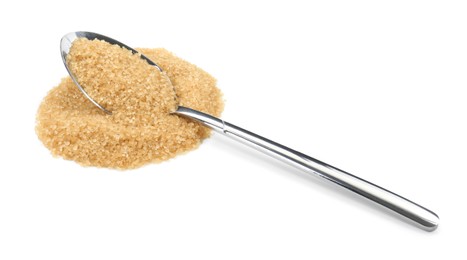 Photo of Pile of brown sugar and spoon isolated on white