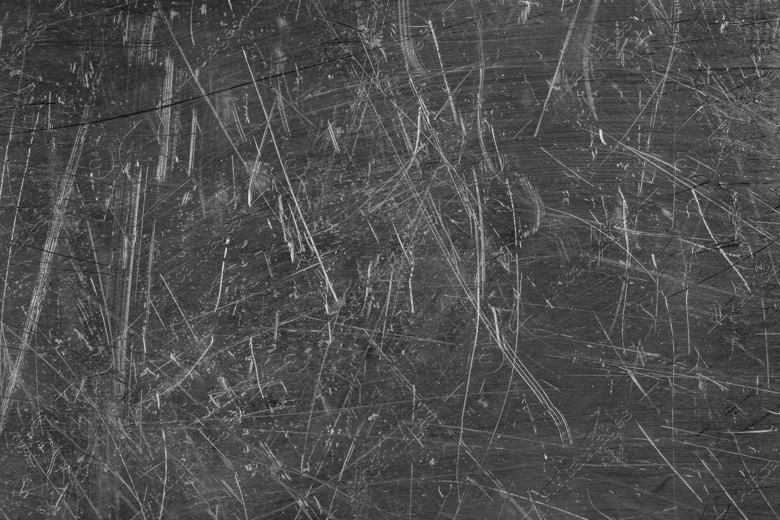 Photo of Texture of scratched metallic surface as background, closeup