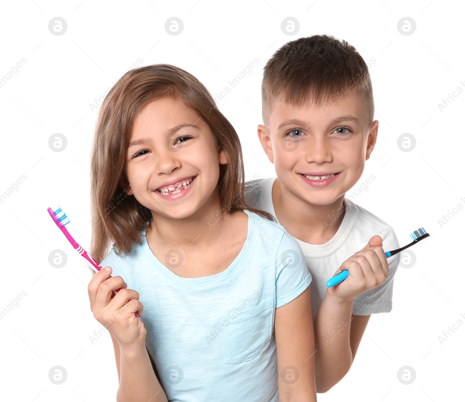 Photo of Portrait of cute children with toothbrushes on white background