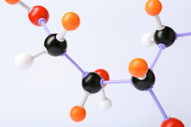 Molecule of sugar on white background, closeup. Chemical model