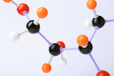 Photo of Molecule of sugar on white background, closeup. Chemical model