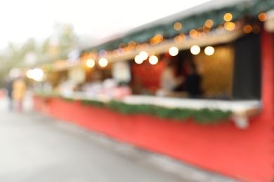 Blurred view of Christmas fair stalls outdoors