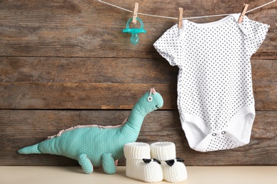 Photo of Composition with baby accessories on wooden background