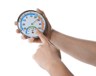 Photo of Woman holding dial hygrometer on white background, closeup