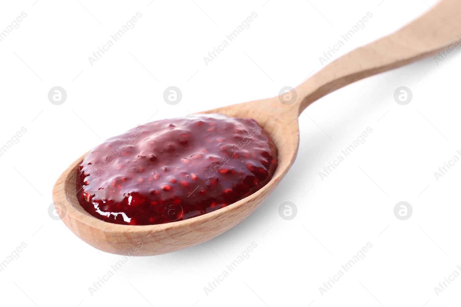 Photo of Delicious raspberry jam in wooden spoon isolated on white