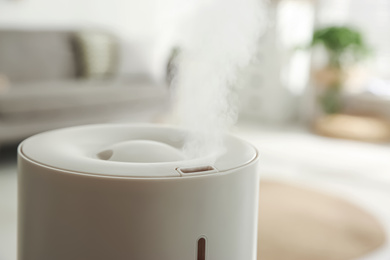 Photo of Modern humidifier indoors, closeup view. Home appliance