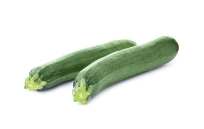 Photo of Raw green ripe zucchinis isolated on white