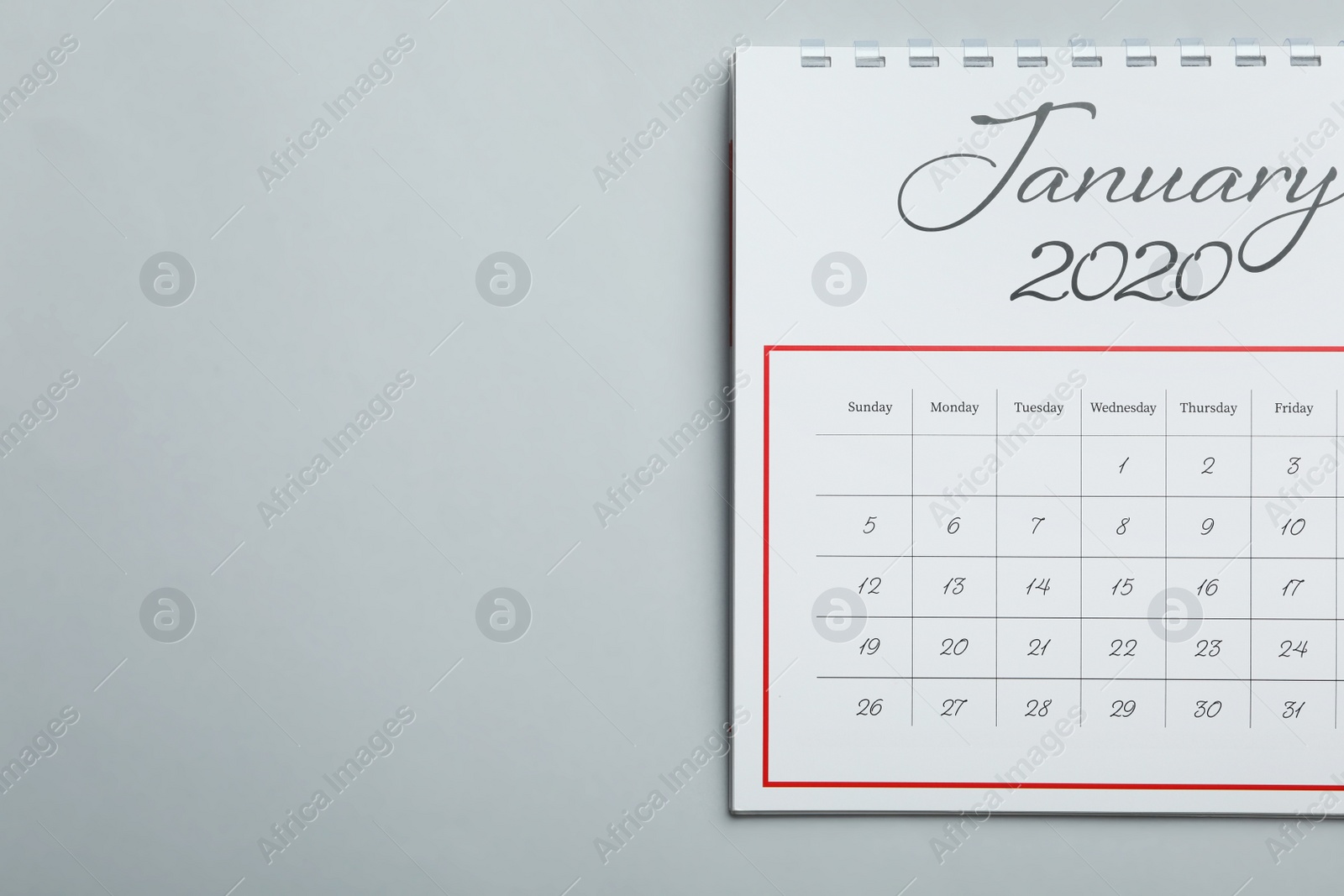 Photo of January 2020 calendar on light grey background, top view. Space for text