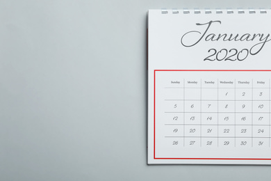 Photo of January 2020 calendar on light grey background, top view. Space for text