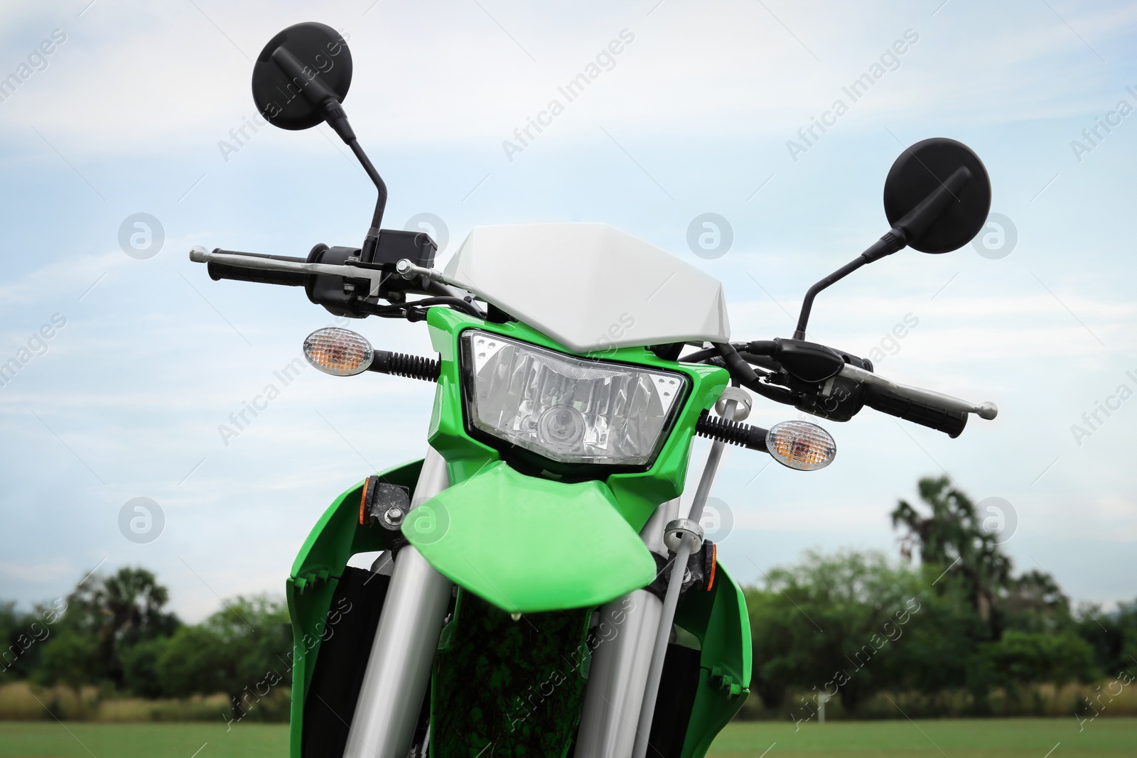 Photo of Stylish cross motorcycle outdoors on cloudy day