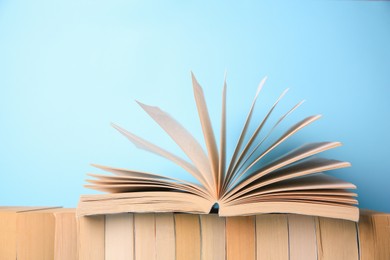 Collection of books on light blue background