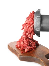 Photo of Metal meat grinder with minced beef and board isolated on white
