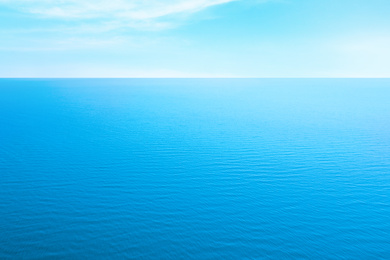 Image of Beautiful ripply sea under blue sky with clouds