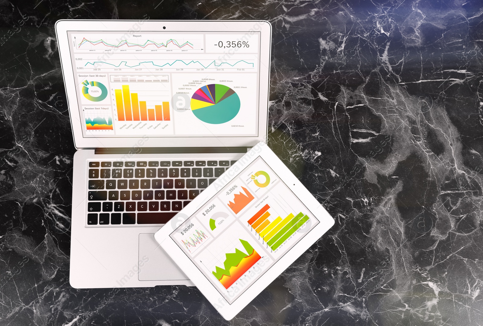 Image of Modernd devices on marble table, top view. Business analytics