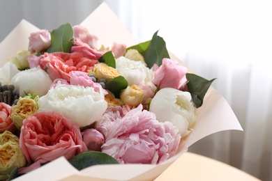 Photo of Beautiful flower bouquet in front of window, closeup