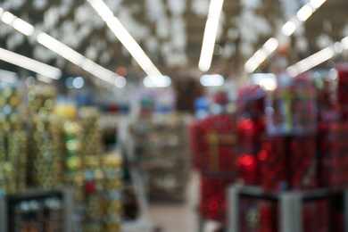 Photo of Blurred view of Christmas decorations in shopping mall. Bokeh effect