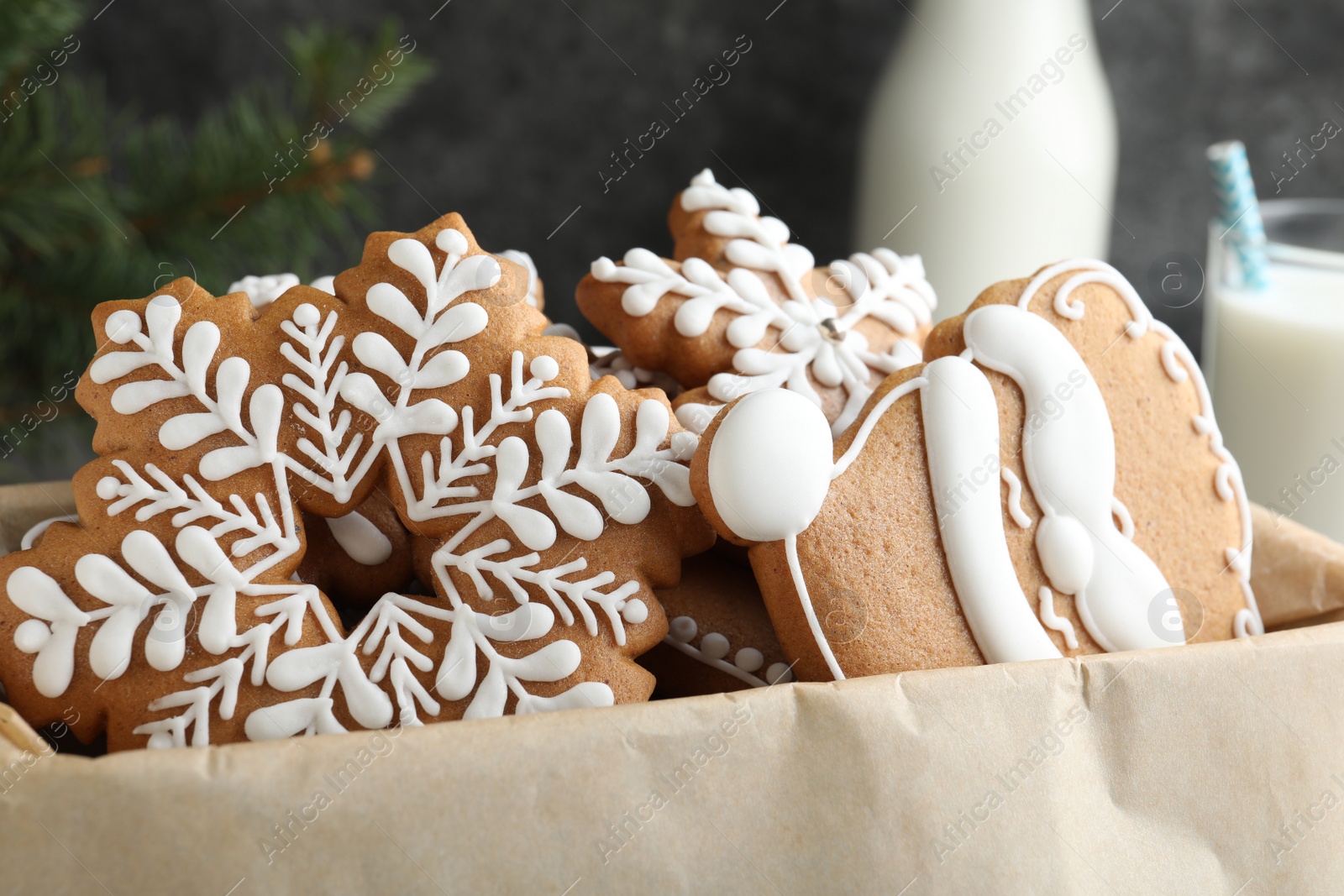 Photo of Decorated Christmas gingerbread cookies in box, closeup