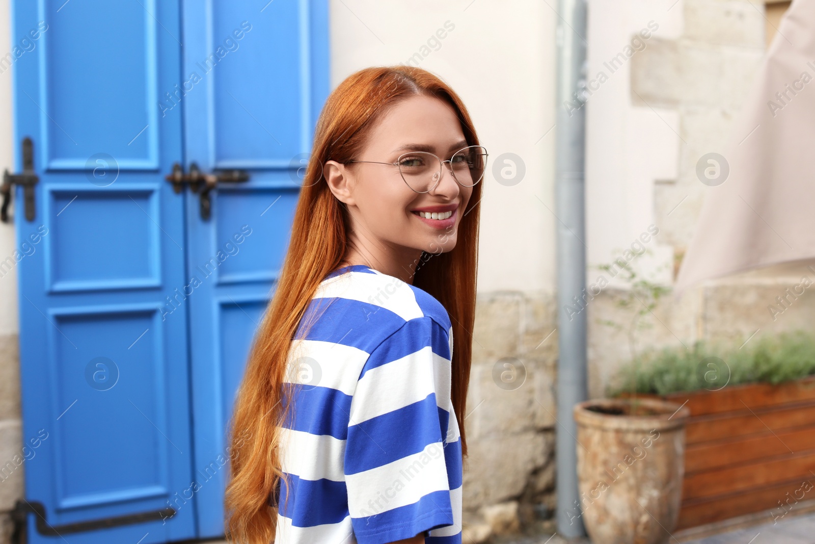 Photo of Portrait of beautiful woman in glasses outdoors